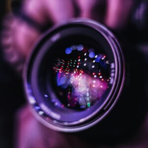 Vibrant reflections in a camera lens; an artistic photography close-up.
