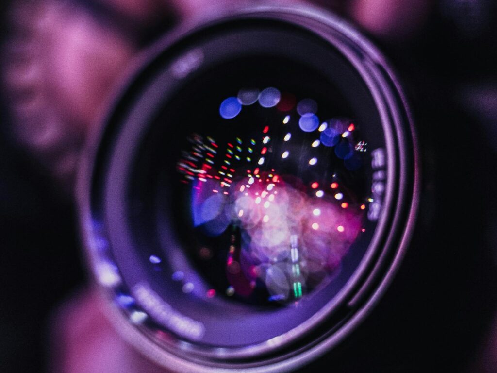 Vibrant reflections in a camera lens; an artistic photography close-up.